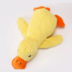 Yellow plush duck dog toy with orange beak and feet on a white background